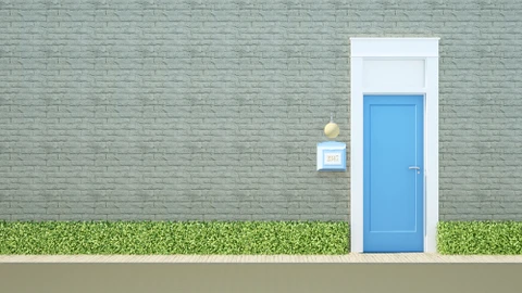 Façade extérieure moderne avec mur en briques peintes vert pâle, porte d'entrée bleue encadrée de blanc, luminaire suspendu doré, plaque d'adresse numérotée, haie verte taillée à la base et trottoir beige